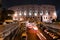 Traffic passes under a bridge leading up to the Colosseum