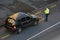 Traffic Police officer writing a traffic citation to a car drive