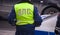 Traffic police officer in yellow vest with Cyrillic letters - traffic police D- road, P-patrol, C-service