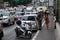 Traffic police and woman talking next to a broken car