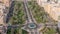 Traffic on a road intersection with roundabout in Barsha Heights and Greens district aerial timelapse.