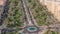 Traffic on a road intersection with roundabout in Barsha Heights and Greens district aerial timelapse.