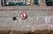 Traffic sign with crossed out anchor on granite embankment of river