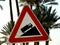 A traffic sign danger steep hill road ahead, a truck on an uphill signal, caution for vehicle drivers to beware of a steep hill in