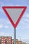 Traffic sign for give way priority yield road with beautiful sky