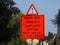 Traffic sign with an inscription "Entry and exit of work vehicle", close-up in Haifa, Israel.