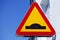 Traffic sign meaning warning of bumps in the road