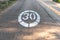 Traffic sign painted on the ground speed limiting at 30