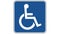 Traffic sign of a person in a wheelchair, the shot is coming into focus and goes again out of focus