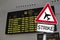 Traffic sign with strike in front of a airport display