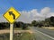 Traffic sign and warning signs on the road, that has a downhill slope