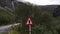 A traffic sign warning about Troll crossing at Trollstigen Road in Norway