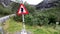 A traffic sign warning about Troll crossing at Trollstigen Road in Norway