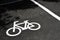 Traffic sign, white bicycle parking sign painted on asphalt floor, copy space
