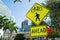 Traffic signs on city road in miami, usa. Bicycle and pedestrian crossing ahead warning. Transportation traffic and travel. Cautio