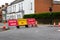 Traffic signs informing the public that the road is closed ahead and to follow the diversion