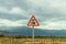 Traffic signs near a railroad crossing