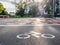 Traffic signs painted on the ground in the city of Madrid, horizontal sign of a biker before a zebra crossing