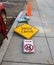 Traffic signs on the sidewalk street