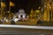 Traffic trails at Cibeles fountain with Puerta Alcala in the background, night in Madrid, Spain