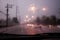 Traffic view through a car windscreen covered in rain