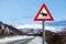 Traffic warning sign with moose near a road in arctic Norway, Ringvassoya