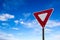 Traffic Yield Sign With Blue Sky Background