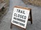 Trail closed due to hazardous conditions sign