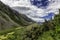 Trail between colorful slopes of mountains in Mount Cook National Park, New Zealand