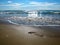 Trail foot on the wet sand of the seashore