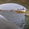 Trail and lake under the arched bridge in Daybreak