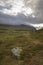 Trail leading to ancient Sami shelter in a desolate and overcast landscape