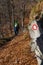 Trail marking on rock with male hiker visible in background