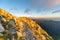 Trail on the mountain peak with golden light at dawn on the Apuan Alps Alpi Apuane, Tuscany, Lucca