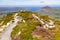 Trail over Diamond hill with Ballynakill Bay and mountains in ba