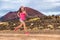 Trail run ultra runner sport woman running training cardio on rocky mountain path on long distance endurance run in