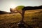 trail runner have a rest on grassland