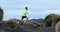 Trail runner man running in mountain nature landscape enjoying training run