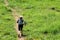 Trail Runner. Sporty Woman runner running trail through the road up to mountain. People strong workout outdoor  in a nature. Weigh