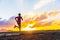 Trail running woman runner on sunset road