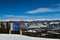 Trail signs and winter panoramic view at ski resort