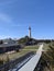 Trail to lighthouse blue sky