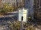 Trail to visitor sign with trail in woods