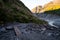 Trail walkway with rocks and river from a glacier. Track: Fox Glacier, New Zealand