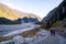 Trail walkway with rocks and river from a glacier. Track: Fox Glacier, New Zealand