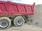 Trailer against a large gravel mound