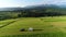 Trailer Caravaning in the mountains. Aerial view of RV car with trailer caravan, parked in the middle of mountain meadow