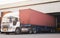 Trailer Truck Loading Package Boxes at Dock Warehouse. Cargo Shipment. Industry Freight Truck Transportation. Warehouse Logistics.