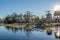 Trailers and motorhomes in a campground beside a lake in Florida in February