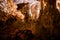 Trails inside the Postojna cave park. It is the second-longest cave system in the country. One of its top tourism sites. The caves